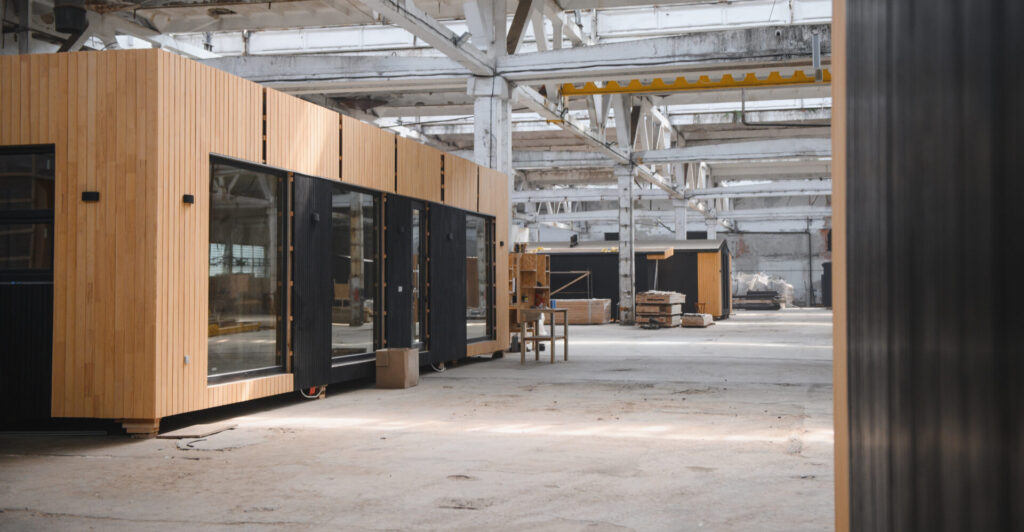 Newly built single storey prefabricated modular building. Prefabricated mobile wooden house at construction site